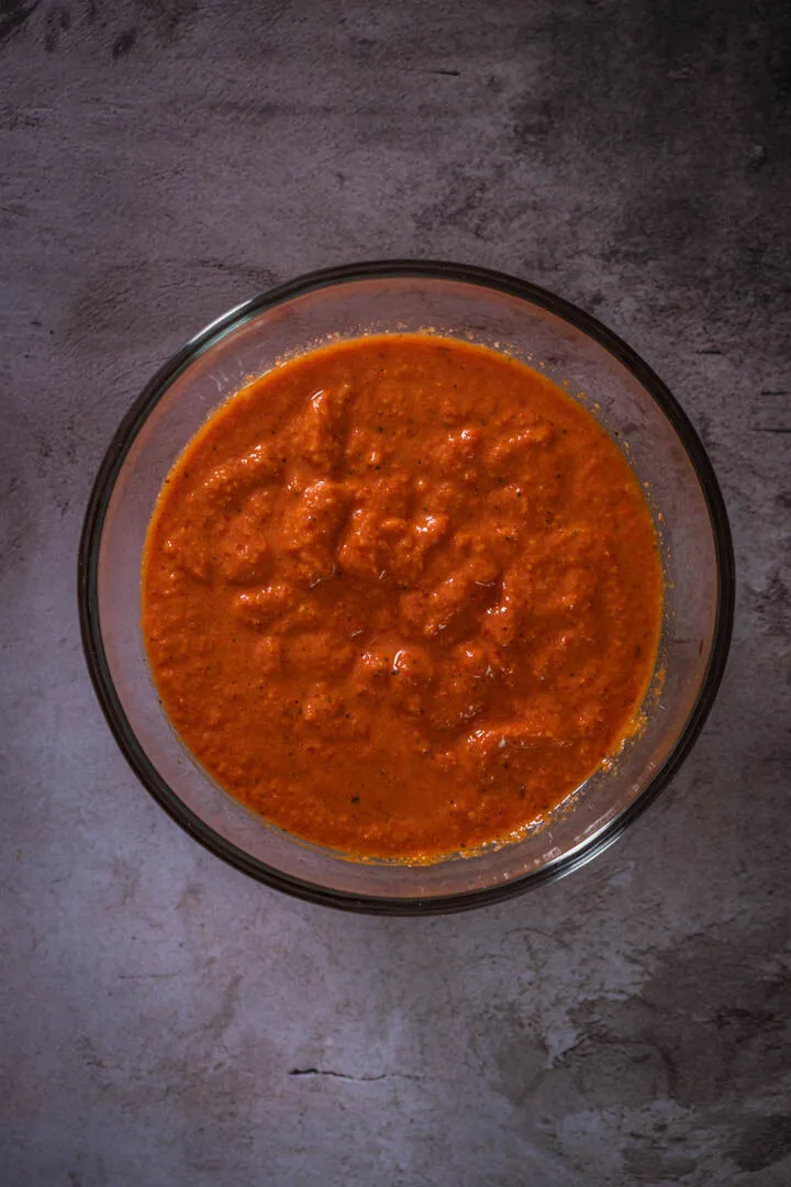 Instructions 1: Blend roasted red peppers, blanched almonds, tomato puree, lemon juice, salt, and pepper until smooth.