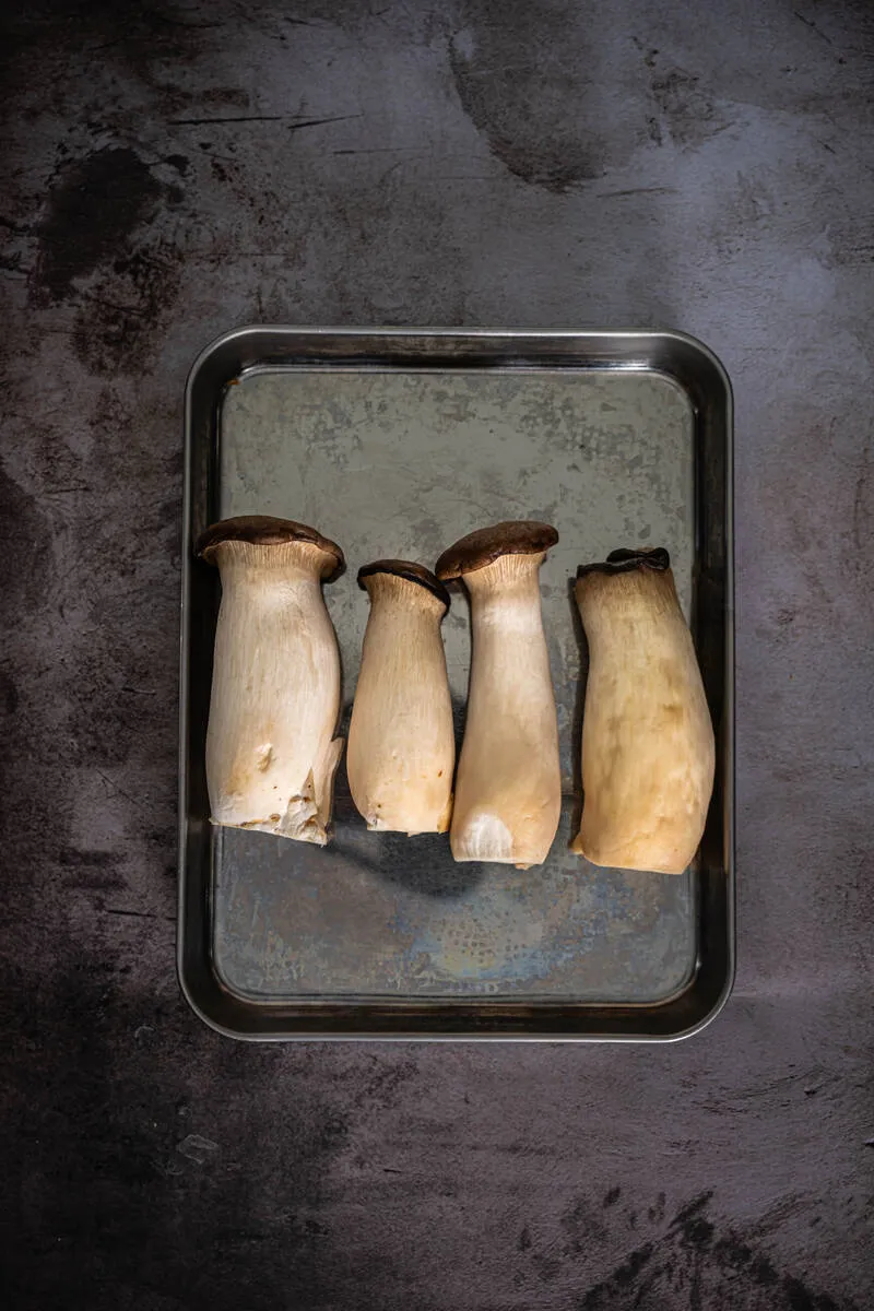 Instructions 1: Slice king oyster mushroom stems into 1/8-inch to 1/4-inch thick rounds. Set aside the caps.