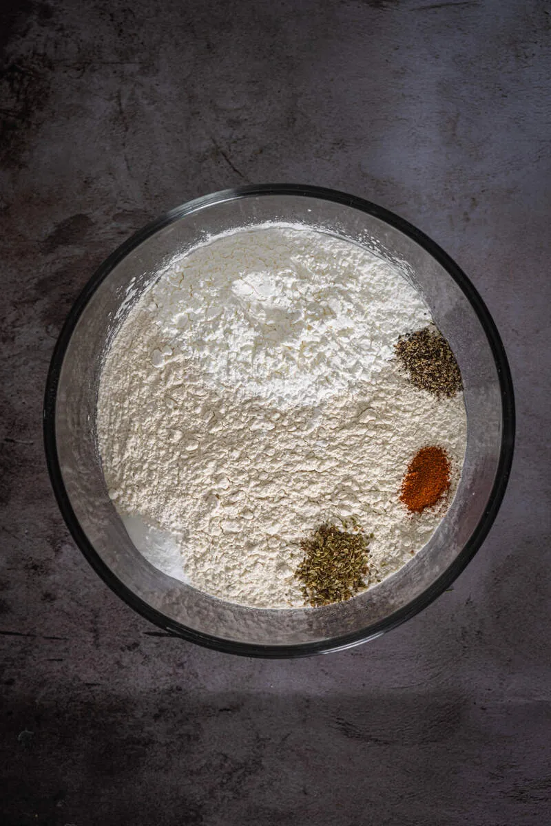 Instructions 2: Whisk together flour, cornstarch, baking powder, oregano, black pepper, and cayenne.