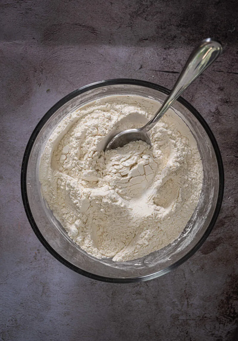 Instructions 3: Add water gradually to the dry ingredients until achieving a pancake-like batter consistency.