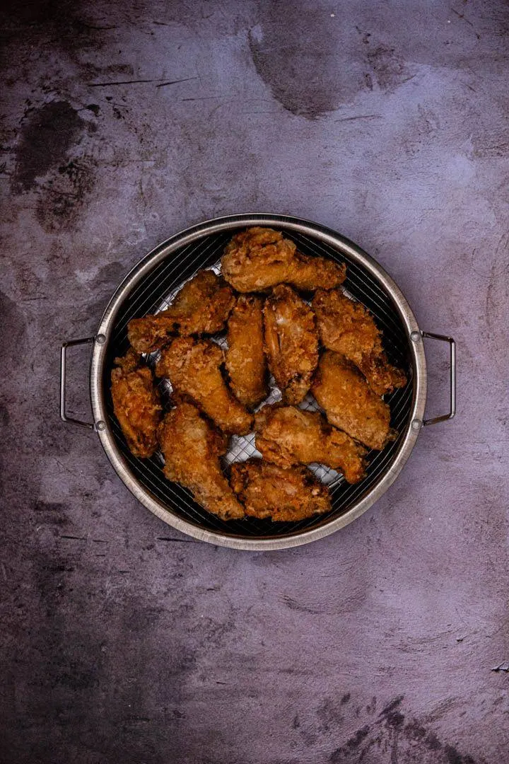 Instructions 7: Increase oil temperature to 375°F (190°C). Fry the wings again for 4 minutes until deep golden and extra crispy. The hig