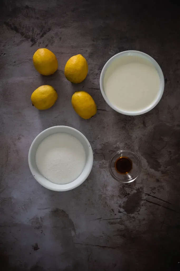 Three simple ingredients for lemon posset brulee: fresh lemons, heavy cream, and granulated sugar