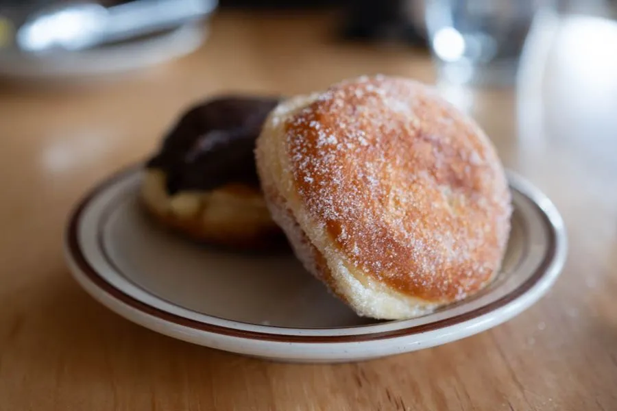 Homemade sugar-dusted and chocolate-glazed donuts served warm at McKiernan