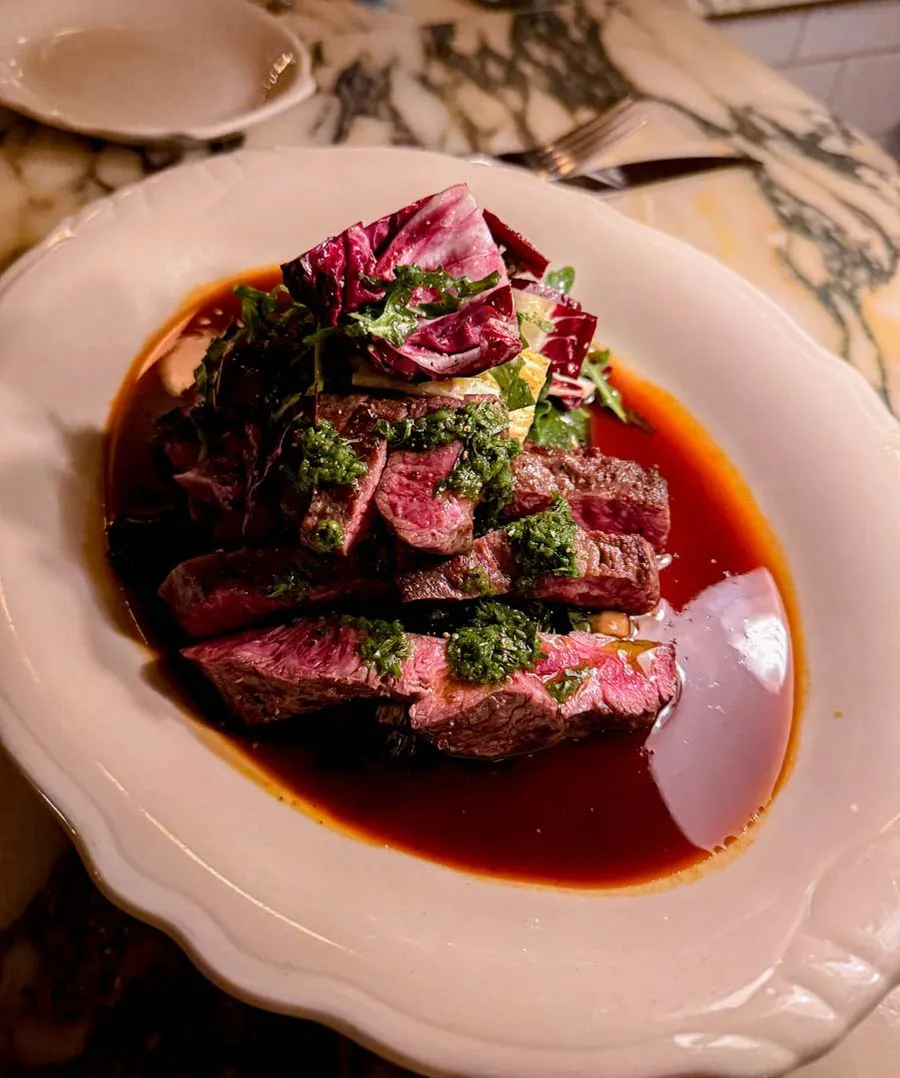 Beef with chimichurri salsa verde, radicchio, and rich jus at Moccione Montreal