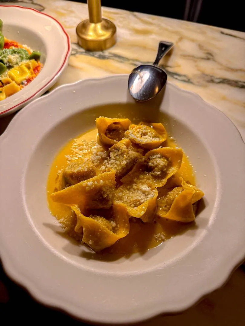 Cappelletti pasta with beef filling in saffron-bergamot sauce with Parmigiano at Moccione Montreal