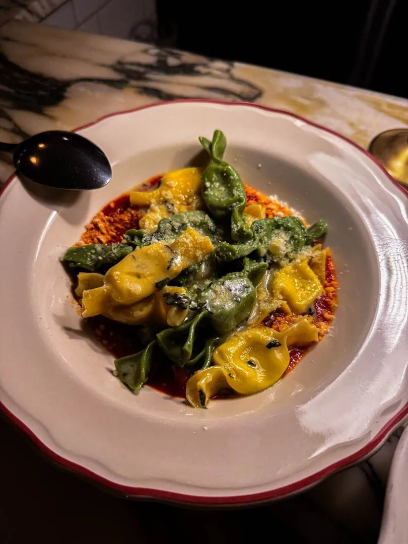 Caramelle pasta with ricotta, artichoke, and rabbit in tomato-sage sauce at Moccione Montreal
