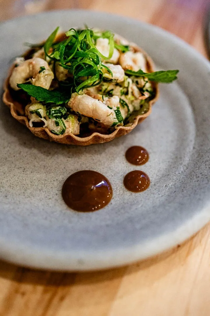 Nordic shrimp tartlet with fennel and agastache at Othym Montreal, a delicate crisp shell with briny-sweet seafood and bright aromatic finish