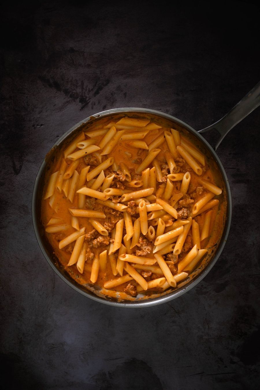 Penne pasta freshly tossed into the creamy vodka sauce with sausage pieces