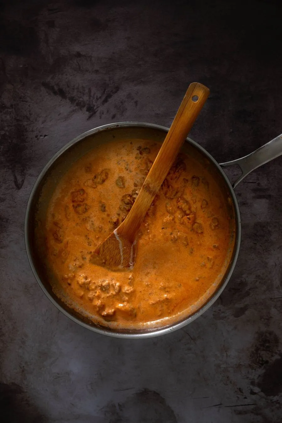 Instructions 2: Pour in vodka, then add chopped tomatoes, tomato puree, and cream. Stir together and simmer for 15-20 minutes until slig