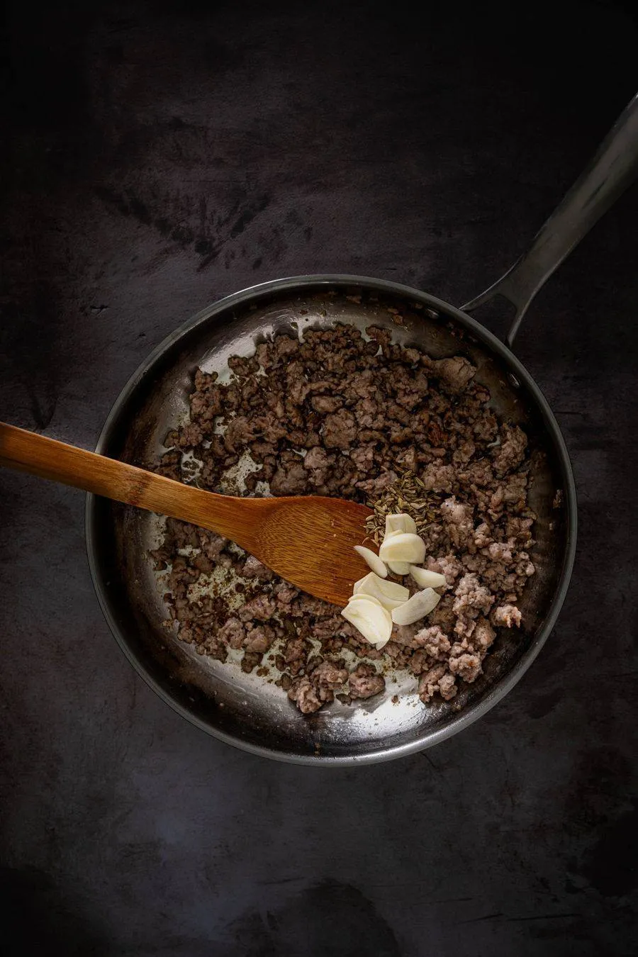 Instructions 1: Heat olive oil in a large pan over medium heat. Add sausage meat, breaking into smaller pieces with a wooden spoon. Cook