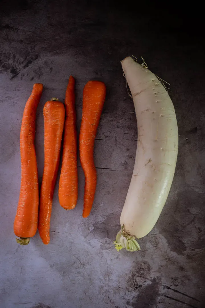 Instructions 1: Julienne the carrots and daikon into thin matchsticks, about 5 cm long and 3 mm thick. Use a julienne peeler, mandoline,
