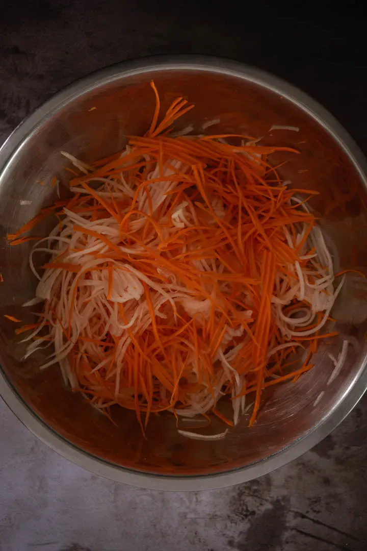 Instructions 2: Place the julienned vegetables in a large bowl and toss thoroughly with the salt. Let them rest for 20 minutes. This dra